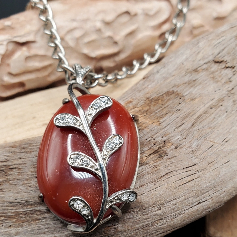 Artisan Carnelian Pendant Wrapped With Leaf Vine Design And Silver Tone Chain